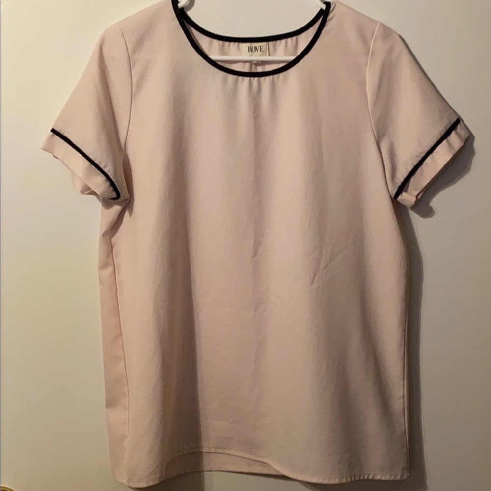 Light pink blouse with black neck and sleeve trim
